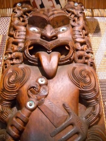 maori sculpture inside the meeting house at waitangi